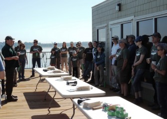 Steve Mooney (left), Project Scientist with OBG, briefs volunteers Saturday morning before activities begin to build and install habitat structures and engage in citizen science monitoring.