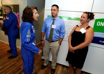 Before the program, alumni of HESA have a chance to meet 2016 HESA teachers. Sue Potrikus (left), HESA 2009, speaks with 2016 HESA teacher Carmen Primiano (center) from Camillus Middle School.