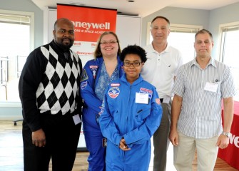 From left are Westside Academy at Blodgett principal Alonzo Graham, Westside Academy teacher Heather Bermingham, Tyara Oliver, John McAuliffe, and Scott Daley, HESA 2013, of Frazer K-8 School. Tyara Oliver, a student at Frazer K-8 School, will attend a student-oriented education program at Space Camp in August.