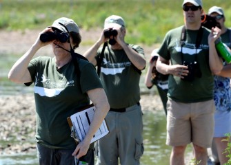 Onondaga Audubon Society (OAS) members help other Corps volunteers identify and record 37 bird species over a few hours Saturday morning.  From left are Angela Thor,  Paul Richardson (President  of OAS), and Frank Moses.