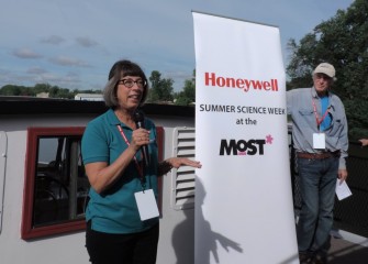 Milton J. Rubenstein Museum of Science & Technology (MOST) President Toni Martin (left) welcomes students aboard the Emita II on Opening Day of Honeywell Summer Science Week. Also shown is MOST Chief Program Officer Peter Plumley, Ph.D., who heads the weeklong hands-on science program.