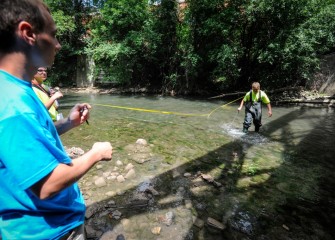 Width, depth and velocity measurements at Onondaga Creek are used to estimate stream discharge rate into Onondaga Lake.