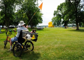 A biker – and companion - at Onondaga Lake Park pause for a photo of “Cusey.”