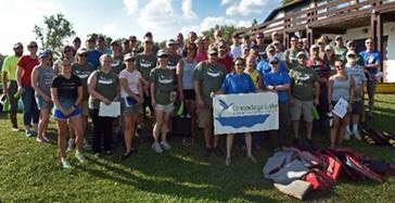 Onondaga Lake Conservation Corps volunteers pledge to protect and conserve the natural resources of Onondaga Lake, promising to educate future generations about becoming caretakers of the water, air, land, and wildlife. Fifty-eight volunteers participated in the event.