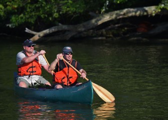 Jim Rhea (left), Principal Engineer and Partner at Anchor QEA, and Dave Fergot, Deputy Commissioner of Onondaga County Parks, continue down Seneca River in search of more water chestnut.