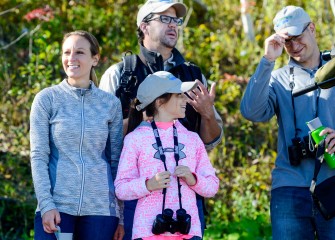 Jeff (right) and Laura McIlroy, of Camillus, and their niece, Ava Purtell, 10, from Baldwinsville, enjoy learning about the variety of birds seen at Onondaga Lake from Onondaga Audubon Society board member Frank Moses (in back).