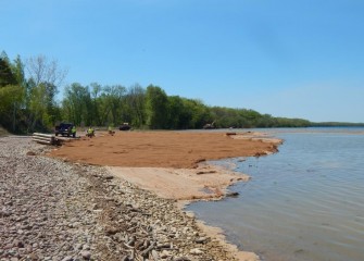 Seeding and placement of biodegradable erosion control blankets begins on the east side of Nine Mile Creek.