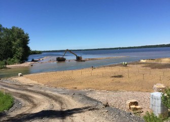 Fresh topsoil placement continues along the western side of the creek. Fine gravel is mixed into the topsoil to provide more structure and reduce erosion.