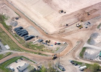 Covering the consolidation area restarts with material deliveries and regrading the leveling layer after its settling over winter.