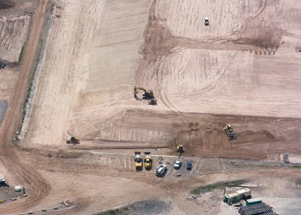 Slopes are regraded around the perimeter of the leveling layer.