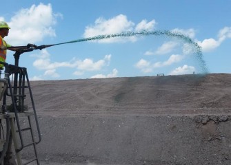 Hydroseeding topsoil with a layer of annual grass begins in August.