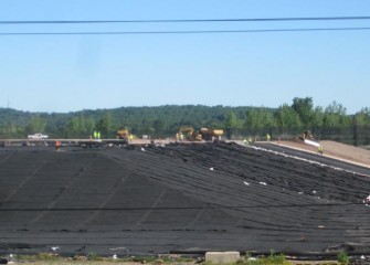 The top liner will be welded to the bottom liner around the perimeter, sealing off the dredged material in geotextile tubes.