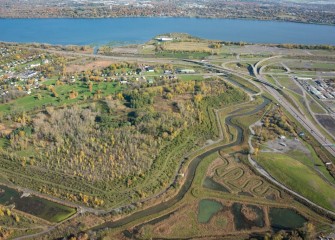 Geddes Brook Wetlands (lower right) and Nine Mile Creek flow toward Onondaga Lake, part of a green corridor connecting upland areas to the lake