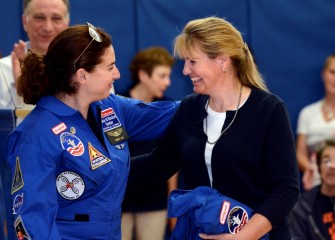 2014 HESA alumna Carolyn Scott (left) congratulates Molly McGarry on being selected to attend Honeywell Educators @ Space Academy in 2015.