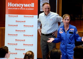 2015 HESA teacher Kathleen Boyce, Lincoln Middle School, describes Space Academy to her students as Honeywell Syracuse Program Director John McAuliffe listens.