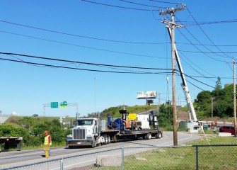 A booster pump part of the pipeline system used in dredging is loaded for transport to another project.