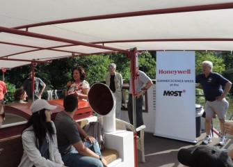 New York State Assembly Member Pamela Hunter (center left) welcomes students at the kickoff of Honeywell Summer Science Week aboard the Emita II.