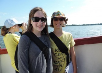 Emma Wilson (center) and Mary Roach (right), from East Syracuse Minoa Central School District, aboard the Emita II.