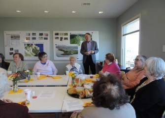 Honeywell Syracuse Program Director John McAuliffe stops by the Visitors Center to welcome the Garden Center Association and talk about recent progress on the Onondaga Lake cleanup.