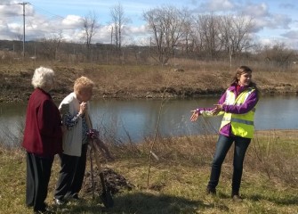 Natalia Cagide-Elmer (right), environmental engineer at Parsons, explains characteristics of the native American sycamore  tree making it well-suited for stream banks and wetlands.