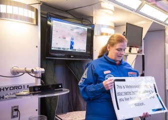 Sally Mitchell, from Pine Grove Middle School, assists in broadcasting the weather from a lunar station during a HESA mission.