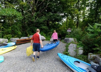Kayakers and canoeists begin their paddle at Honeywell’s Airport Road fishing access area in the Town of Camillus.
