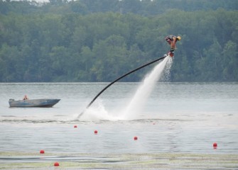 A flyboard demonstration takes place between corporate rowing heats.