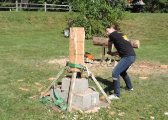 State University of New York College of Environmental Science and Forestry Woodsmen Team member Michelle Vasiloff demonstrates competition wood cutting.