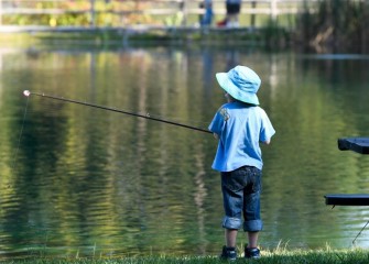 Four-year-old Zechariah Hartsell, of Fayetteville, fishes for trout.