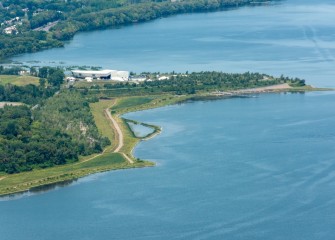 Ten acres of wetlands have been restored in low-lying areas along the Western Shoreline. The dock at Lakeview Point Landing, used for boater access to concerts at the amphitheater, can be seen center right.