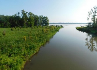 Restored wetlands at the mouth of Nine Mile Creek (left) were designed to adapt to varying water level conditions through the year as waters flood over banks and recede.