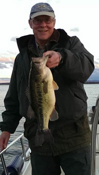 Ringler is an avid fisherman in his free time and is pictured above holding a largemouth bass caught in Onondaga Lake. He has studied the Onondaga Lake fishery for more than 30 years and is Vice Provost at the State University of New York College of Environmental Science and Forestry (SUNY-ESF).