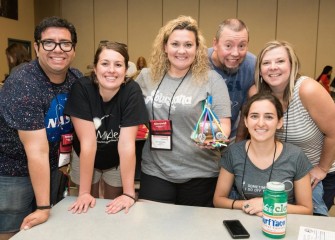 Erin Emanuele (bottom right) with fellow Honeywell Educators during the Eggs Prize challenge.  The payload – a raw egg – and land rover must survive a 15-25 foot drop intact using a limited budget of cushioning materials.