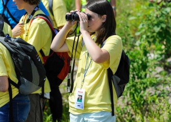 Genevieve Esker, a student in the North Syracuse Central School District, observes waterfowl on Onondaga Lake.