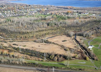 Geddes Brook (right) flows into Nine Mile Creek and Onondaga Lake (background)