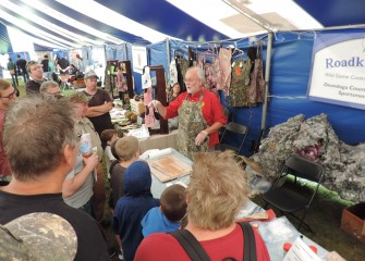 Stephen Wowelko, President of the New York State Outdoorsmen Hall of Fame, demonstrates fileting and cooking pickerel at Honeywell Sportsmen’s Days.