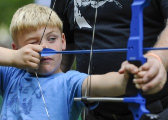 Robert Murray, of Elbridge, aims before taking a shot at the target.