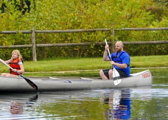 Cody Mehlenbacher (right), of Auburn, enjoys paddling across the pond at Carpenter’s Brook Fish Hatchery with his daughter Gabriella.