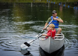 Dexter Rinaldi tries paddling backwards and with his dad, Damian. The father and son from Warners attended Honeywell Sportsmen’s Days for the first time this year.