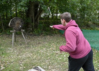 Luke Foster Springett, of Clay, throws a hatchet toward the wooden target.