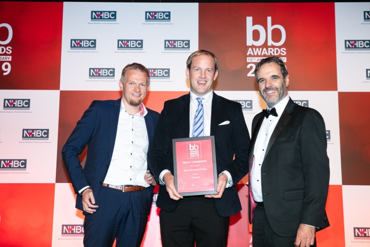 Lord Matthew Taylor of Goss Moor (right) presents Honeywell’s Nicholas Tymko (center) with a “highly commended” certificate in the Best International Project category at the 2019 Brownfield Briefing Awards.