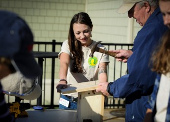 Shannon Fabiani, with the Young Naturalists Leadership Team, works together with Paul Marconi (right), Onondaga Lake Conservation Corps member, to build a new nesting box.