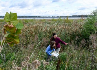 Janna Keefe and daughter Evie work on the scavenger hunt inventorying plant species.