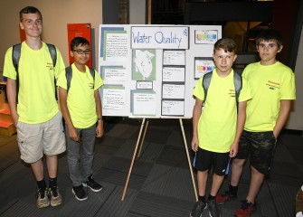 Students (left to right) Xavier Greene, Ahmed Fakhr, Nate Porter, and Lucas Aldinger analyzed data and created a poster on water quality for Discovery Day.