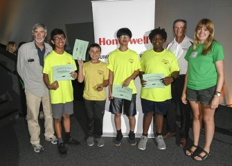 Team Purple displays their completion certificates which entitle each student to membership in the Museum of Science and Technology for one year.