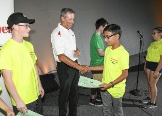 Honeywell’s Stephen Miller congratulates each student at the recognition ceremony.