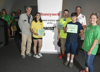 Members of Team Blue display their recognition certificates for completion of Honeywell Summer Science Week.